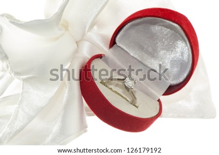 wedding favors and wedding rings on white background