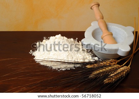 Flour, wheat ears wooden table