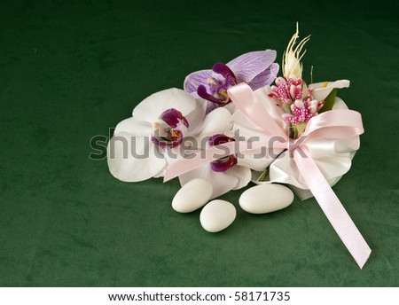 candy wedding favors and packaging materials on a green background