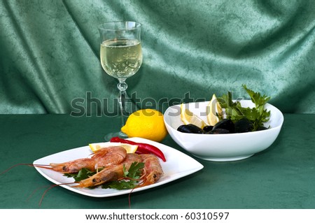 plate of crayfish and mussels with parsley on a green background