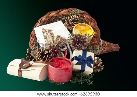 Cornucopia full of gift items on a green background