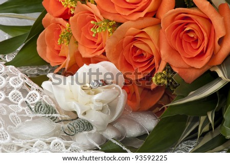weeding Favors, wedding rings and orange roses