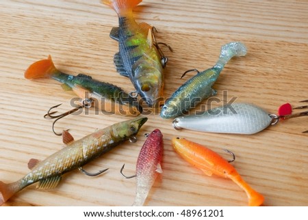 fishing lures on wood circle shape