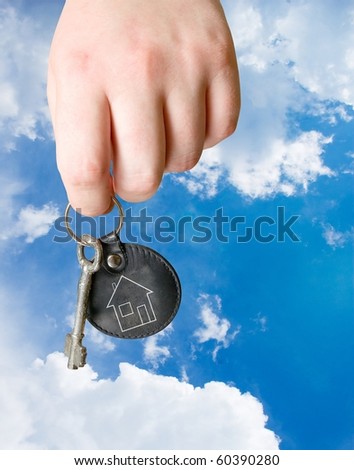 key chain with retro key in human hand