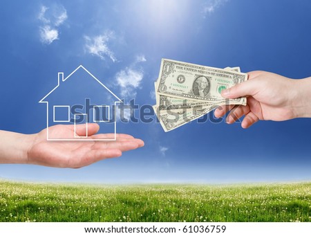 Buy new house concept. Hand with money and house shape over landscape
