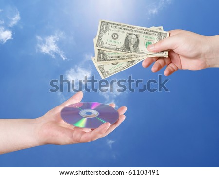 Man\'s hand with dollars and CD isolated