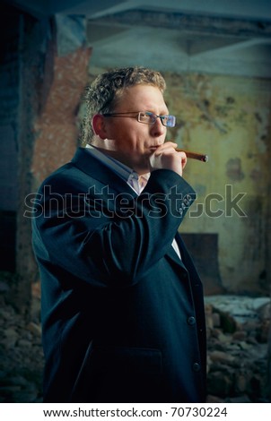 man in black suite in abandoned house. gangster boss theme