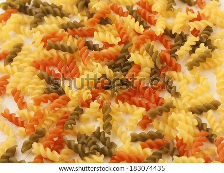 Pasta Fusilli texture background. Pasta is a staple food of traditional Italian cuisine.