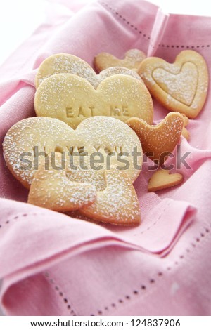 Home Baked heart cookies with I love you and Eat me written on them
