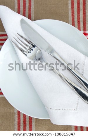 Table Place setting with knife and fork and linen