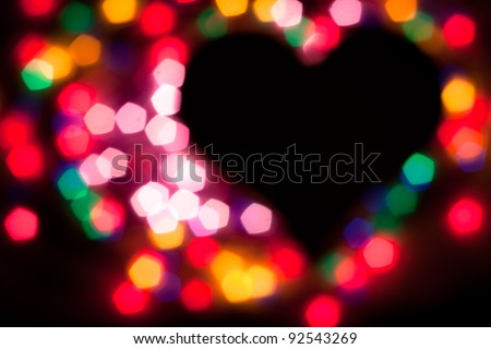 De-focused colorful lights in heart shape. No focus!