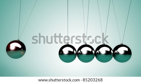 close up of the Newton\'s cradle, particularly of the spheres
