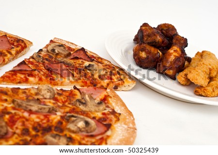 Sliced large mushroom and ham hawaiian pizza isolated on white