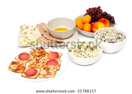 light dinner with fruit, cheese, salad, bread and crackers