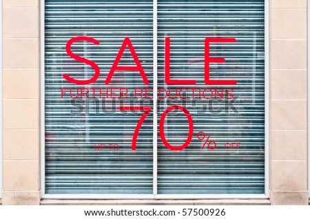 photograph of 70% sale sign on a shop window
