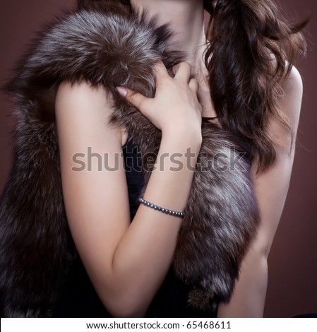 Woman in silver fox fur, focus on fur.  Fashion art photo.