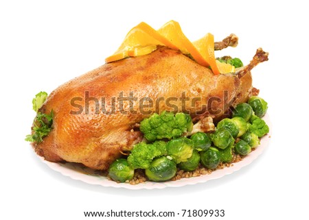 roast goose stuffed with buckwheat porridge, Brussels sprouts and broccoli isolated on white