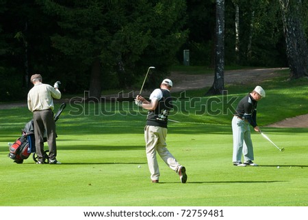 MOSCOW - AUGUST 8: A group unidentified golfers compete at the annual VI Moscow Festival Retrostyle event for fans and professionals at the Le Meridien Moscow County Club on August 8, 2008 in Moscow, Russia