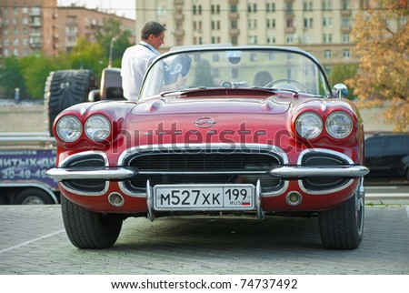 MOSCOW, RUSSIA-JULY 31: Red Corvet in exhibition parking at an annual event, the VI race of vintage cars \'Night Moscow Classic Rally\'. July 31, 2010 in Moscow, Russia