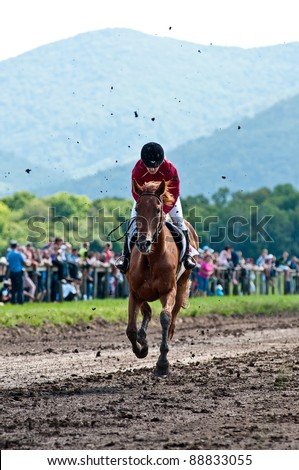ARSENEV, RUSSIA - SEPTEMBER 03: Unidentified jockey and horse after crossing the finish line during the Riding show 