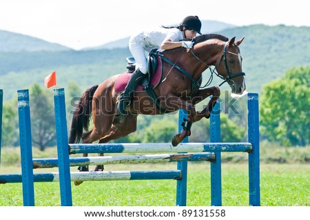 ARSENEV, RUSSIA - SEPTEMBER 03:  Unidentified rider in action rides horse show jumps at the Riding show 