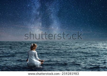 serenity and yoga practicing at the sea under night sky