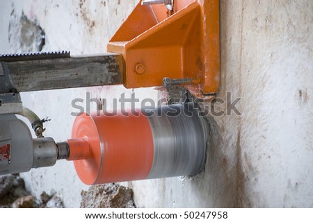 Concrete core drilling machine on a building construction site