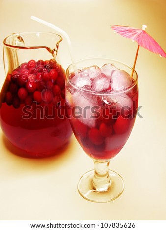 fruit cherry cocktail punch in jug with ice and fruit