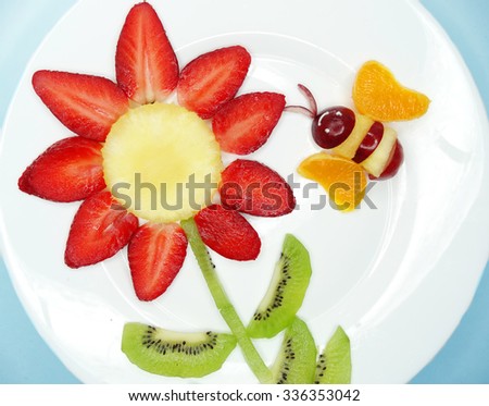 creative fruit dessert for child funny form bee gathering pollen on the flower
