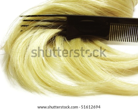 hair brush with long blond hair in it