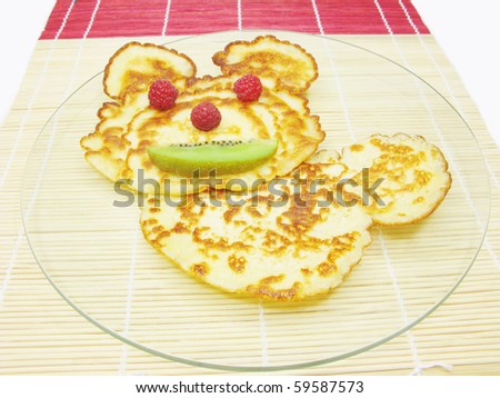 sweet pancake with raspberry and kiwi animal face creative food