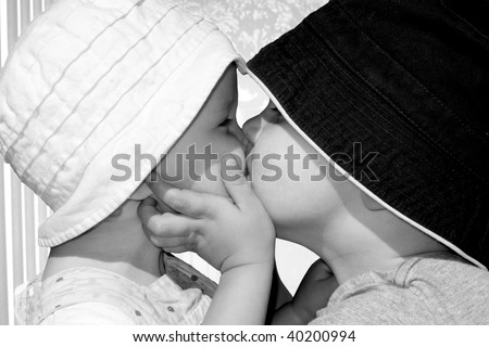 Tender kiss between brother and sister