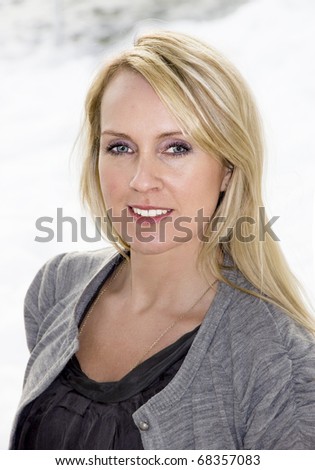 stock photo Portrait of naturally beautiful blonde woman in her thirties