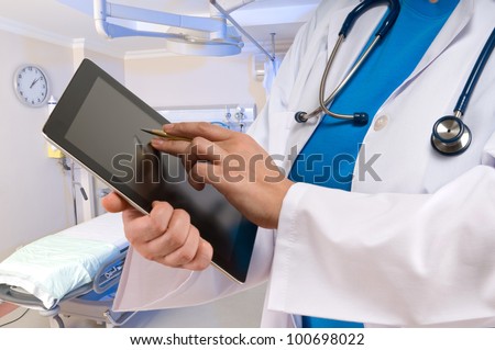 Doctor pointing on tablet PC
