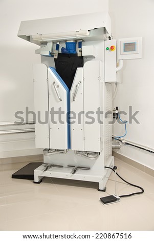Automatic ironing machine at dry cleaner