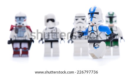 Ankara, Turkey - May 28, 2013: Lego Star Wars minifigure Sandtrooper walking infront of sandtroopers and stormtroopers isolated on white background.