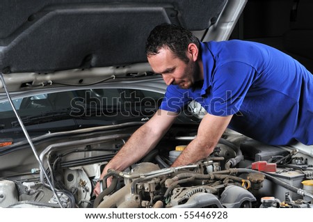Car mechanic working on a car - a series of MECHANIC related images.