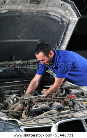 Car mechanic working on a car - a series of MECHANIC related images.