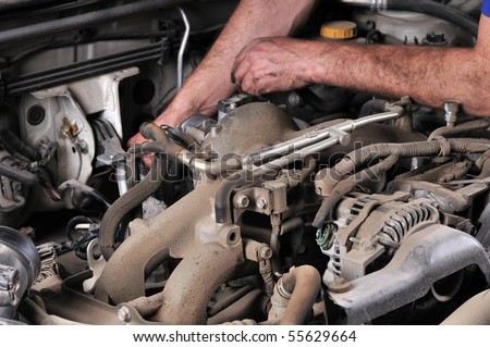 car mechanic info on Auto mechanic's hands working on car - a series of MECHANIC related ...