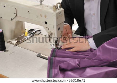 Tailor using industrial sewing machine - a series of TAILOR related images.