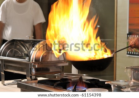 Professional cook preparing food on flame â?? a series of RESTAURANT images.