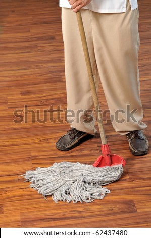 Housekeeper mobbing the floor - a series of HOTEL images.