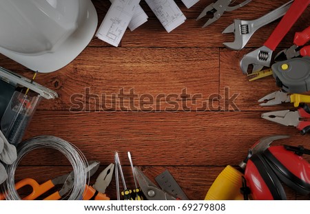 Construction instrument on wood background with copy space.