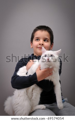 مسابقة المنتدي الكبري - صفحة 3 Stock-photo-cute-boy-and-his-white-cat-looking-at-the-copy-space-for-your-text-69574054