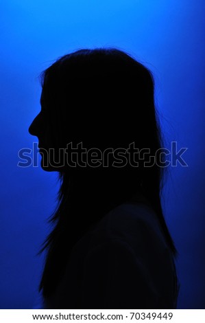 Female silhouette over blue background.