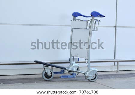 Luggage cart at modern airport.