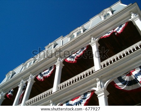 patriotic fans on old two story building