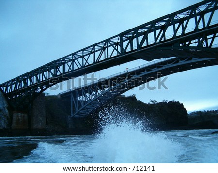 jet boat wake under bridge