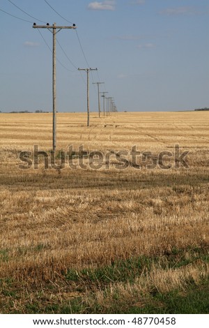 Power   on Old Power Line Over Prairie Farm Land Stock Photo 48770458