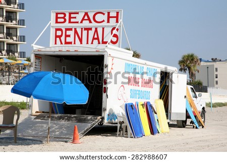 DAYTONA BEACH, FL-MAY, 2015:  Beach vendor offers anything you'll need to enjoy your day on the 